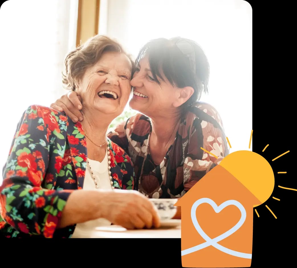 Two elderly women smiling together