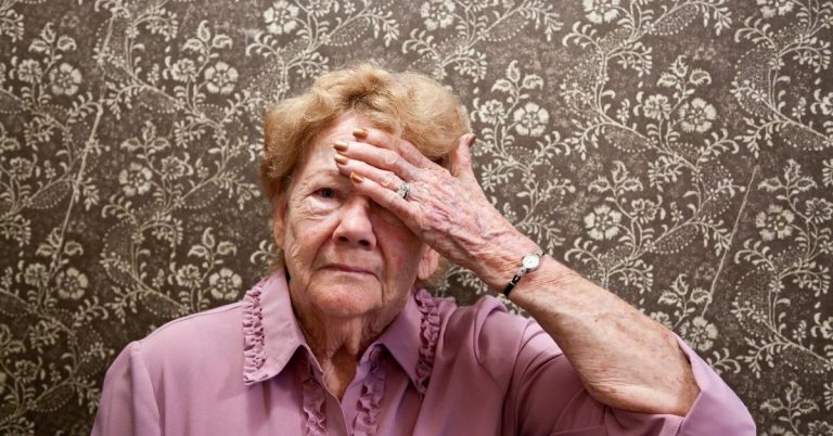 elderly woman stressed over not knowing aged care rights