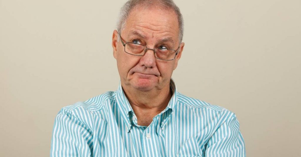 elderly man thinking about making complaint